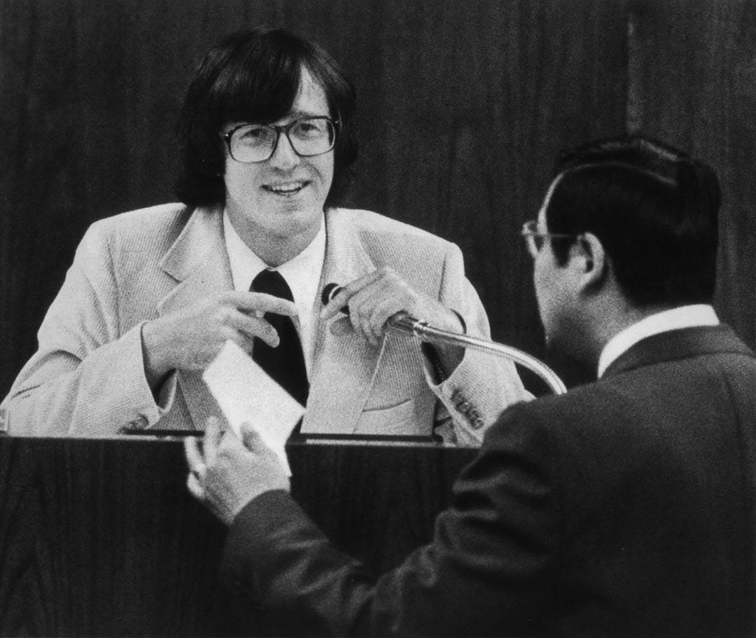 Two men at a podium with a microphone