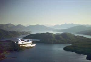 Plane flying over lake